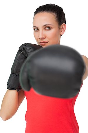 simsearch:400-06876600,k - Portrait of a determined female boxer focused on her training over white background Stock Photo - Budget Royalty-Free & Subscription, Code: 400-07475704