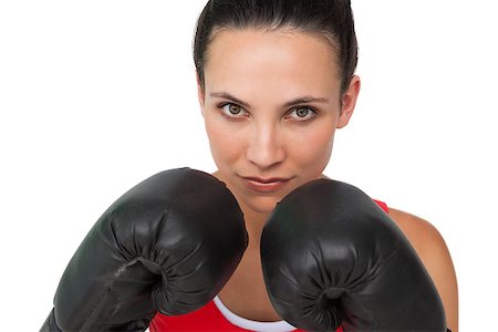 simsearch:400-07143098,k - Close-up portrait of a determined female boxer focused on her training over white background Stock Photo - Budget Royalty-Free & Subscription, Code: 400-07475705