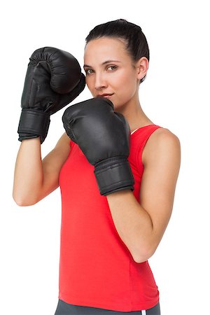 simsearch:400-06876600,k - Portrait of a determined female boxer focused on her training over white background Stock Photo - Budget Royalty-Free & Subscription, Code: 400-07475703