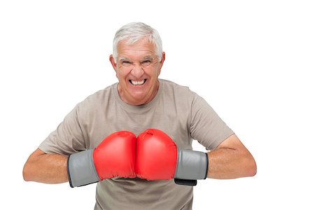 simsearch:693-07455847,k - Close-up portrait of a determined senior boxer over white background Stockbilder - Microstock & Abonnement, Bildnummer: 400-07476283