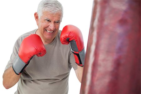 simsearch:693-07455847,k - Portrait of a determined senior boxer over white background Stockbilder - Microstock & Abonnement, Bildnummer: 400-07476347