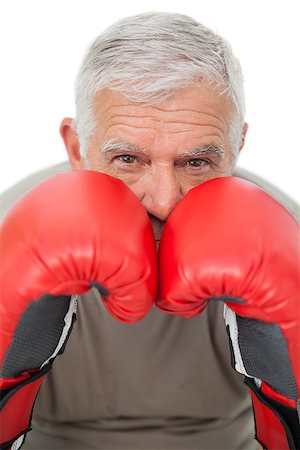 simsearch:400-07143098,k - Close-up portrait of a determined senior boxer over white background Stock Photo - Budget Royalty-Free & Subscription, Code: 400-07476350