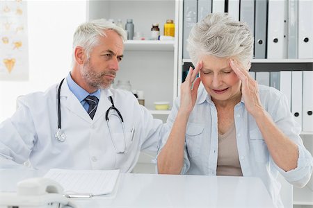 Female senior patient visiting a doctor at the medical office Stock Photo - Budget Royalty-Free & Subscription, Code: 400-07476379