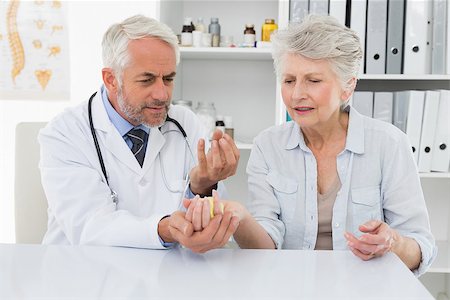 Female senior patient visiting a doctor at the medical office Stock Photo - Budget Royalty-Free & Subscription, Code: 400-07476406