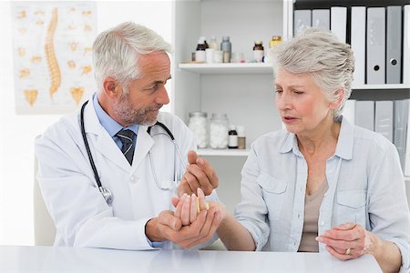 Female senior patient visiting a doctor at the medical office Stock Photo - Budget Royalty-Free & Subscription, Code: 400-07476407