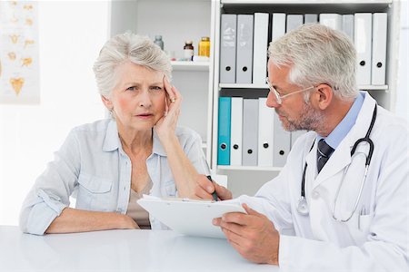 Female senior patient visiting a doctor at the medical office Stock Photo - Budget Royalty-Free & Subscription, Code: 400-07476414