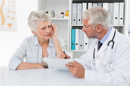 Female senior patient visiting a doctor at the medical office Stock Photo - Budget Royalty-Free & Subscription, Code: 400-07476413