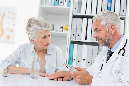 Female senior patient visiting a doctor at the medical office Stock Photo - Budget Royalty-Free & Subscription, Code: 400-07476422