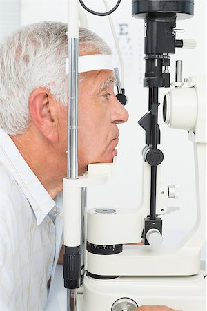 eye doctor (male) - Close-up side view of a senior man getting his cornea checked Stock Photo - Budget Royalty-Free & Subscription, Code: 400-07476615