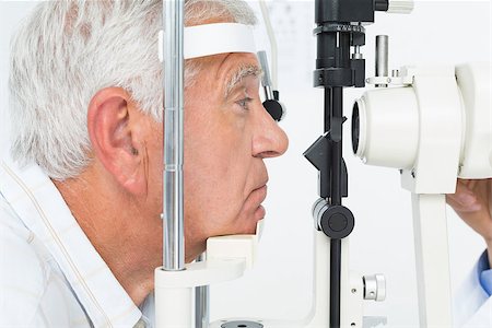 simsearch:400-08407302,k - Close-up side view of a senior man getting his cornea checked Stock Photo - Budget Royalty-Free & Subscription, Code: 400-07476612