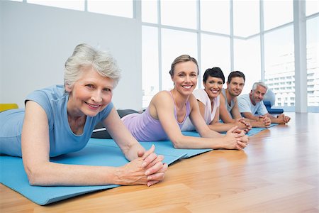 senior woman yoga class - Portrait of a fitness group lying in row at the yoga class Stock Photo - Budget Royalty-Free & Subscription, Code: 400-07476808