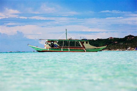 philippine fishing boat pictures - Traditional Philippine boat in a gulf. Island Boracay Stock Photo - Budget Royalty-Free & Subscription, Code: 400-07477408