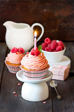 simsearch:400-05927881,k - Sweet cupcakes with fresh raspberry and birthday candle. Stock Photo - Budget Royalty-Free & Subscription, Code: 400-07477636