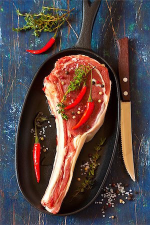 Fresh raw meat on a pan and vegetables. Stock Photo - Budget Royalty-Free & Subscription, Code: 400-07477670