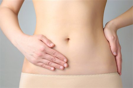 digestion female - Young woman having stomach pain Foto de stock - Super Valor sin royalties y Suscripción, Código: 400-07477783