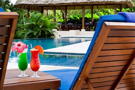 simsearch:400-06797125,k - fresh tropical juice cocktail served pool side in Belize Stock Photo - Budget Royalty-Free & Subscription, Code: 400-07477809