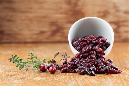 Fresh organic cranberries and a bowl with dried cranberries Stock Photo - Budget Royalty-Free & Subscription, Code: 400-07478013
