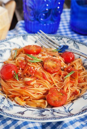 delicious pasta - Portion of fresh spaghetti with tomato sauce on wooden table Stock Photo - Budget Royalty-Free & Subscription, Code: 400-07478049