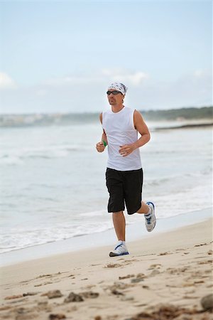 simsearch:400-04968857,k - man is jogging on the beach summertime sport fitness run jogger runner Stock Photo - Budget Royalty-Free & Subscription, Code: 400-07478086