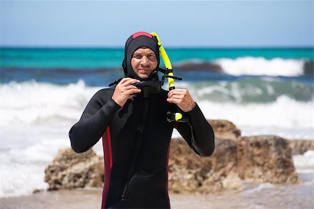 simsearch:400-04007432,k - male diver with diving suit snorkel mask fins on the beach in Summer Stock Photo - Budget Royalty-Free & Subscription, Code: 400-07478238