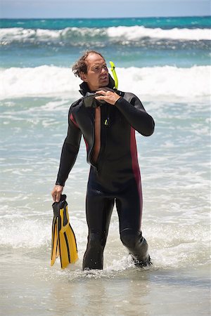 simsearch:400-04007432,k - male diver with diving suit snorkel mask fins on the beach in Summer Stock Photo - Budget Royalty-Free & Subscription, Code: 400-07478239