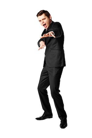 Young businessman dancing hip-hop against white background. Stock Photo - Budget Royalty-Free & Subscription, Code: 400-07478974