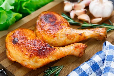 Chicken legs with rosemary on a cutting board Stock Photo - Budget Royalty-Free & Subscription, Code: 400-07479103