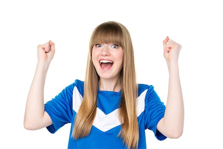 person playing soccer standing back - Happy girl in blue soccer shirt is holding her fists up Stock Photo - Budget Royalty-Free & Subscription, Code: 400-07479226