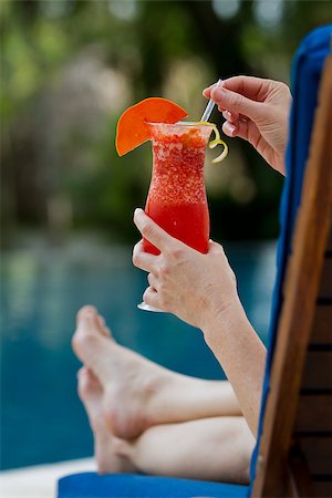 fresh tropical juice cocktail served pool side in Belize Stock Photo - Budget Royalty-Free & Subscription, Code: 400-07479283