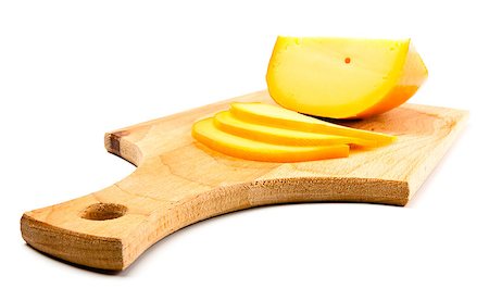 cheese slices on cutting board isolated on white Photographie de stock - Aubaine LD & Abonnement, Code: 400-07479430