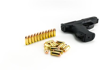 simsearch:400-07984057,k - Black semiautomatic handgun with bullets on a white background Stockbilder - Microstock & Abonnement, Bildnummer: 400-07479518