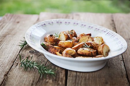 roasting potatoes - Roasted potatoes. Healthy vegetarian food. Baked vegetables. Photographie de stock - Aubaine LD & Abonnement, Code: 400-07479679