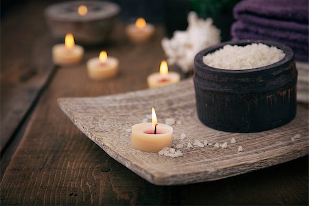spa background - Spa and wellness setting with natural bath salt, candles, towels and flower. Wooden dayspa nature set Stock Photo - Budget Royalty-Free & Subscription, Code: 400-07479693