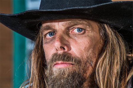 Close-up of a gruff looking old west bandit Stock Photo - Budget Royalty-Free & Subscription, Code: 400-07472617