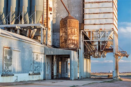 simsearch:400-07429824,k - old grain elevator with pipes, ducts, ladders and chutes, a distant rural landscape of northern Colorado Stock Photo - Budget Royalty-Free & Subscription, Code: 400-07472665