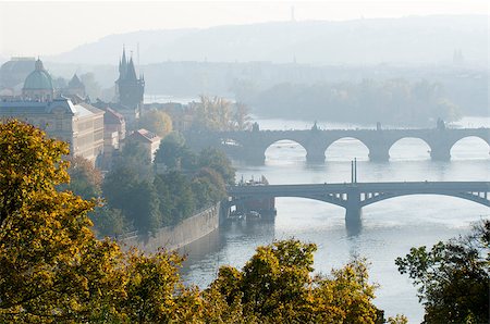 simsearch:400-07620236,k - This is a morning view of the bridges on the Vltava River in Prague, Czech Republic. Yellow trees flavor the cityscape. Stock Photo - Budget Royalty-Free & Subscription, Code: 400-07473086