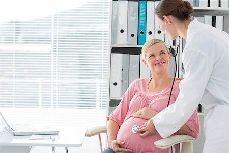 Female doctor examining pregnant woman in clinic Stock Photo - Budget Royalty-Free & Subscription, Code: 400-07473263