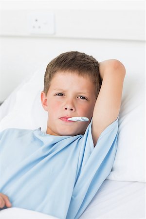 simsearch:400-07473471,k - Portrait of sick little boy in hospital with thermometer in mouth Photographie de stock - Aubaine LD & Abonnement, Code: 400-07473463