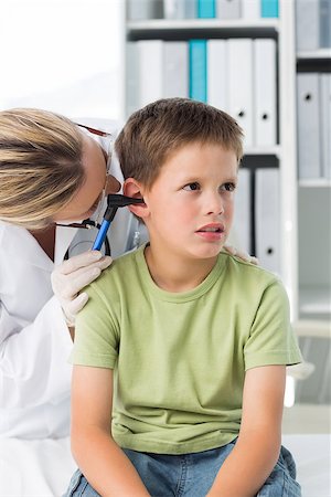 simsearch:400-06734647,k - Little boy being examined by female doctor with otoscope in clinic Stock Photo - Budget Royalty-Free & Subscription, Code: 400-07473515