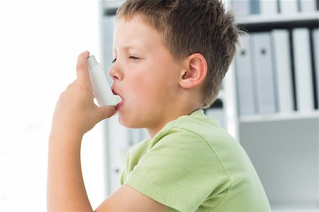 photo of patient in hospital in usa - Side view of little boy using an asthma inhaler in clinic Stock Photo - Budget Royalty-Free & Subscription, Code: 400-07473537