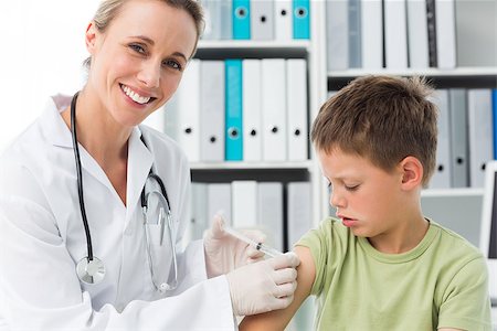 simsearch:400-06734647,k - Little boy receiving an injection by female pediatrician in clinic Stock Photo - Budget Royalty-Free & Subscription, Code: 400-07473533