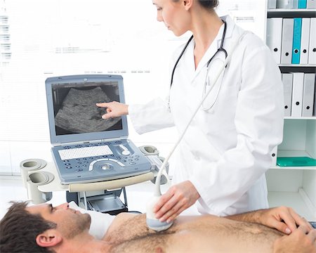 female cardiologist - Female cardiologist using sonogram on male patient in examination room Stock Photo - Budget Royalty-Free & Subscription, Code: 400-07473545
