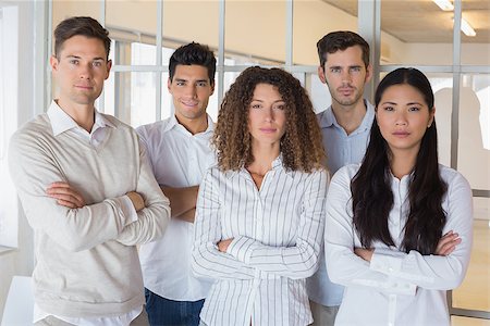 simsearch:400-07186359,k - Casual business team looking at camera with arms crossed in the office Stock Photo - Budget Royalty-Free & Subscription, Code: 400-07484101