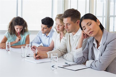 Casual businesswoman falling asleep during meeting in the office Stock Photo - Budget Royalty-Free & Subscription, Code: 400-07484159