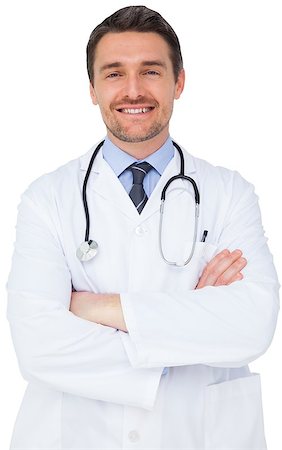 simsearch:400-04217553,k - Handsome young doctor with arms crossed on white background Foto de stock - Royalty-Free Super Valor e Assinatura, Número: 400-07484207