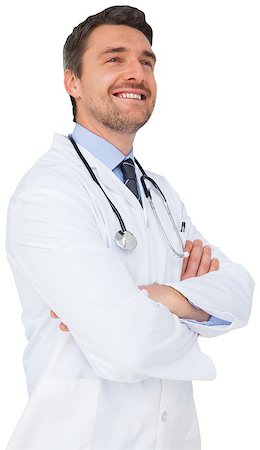 simsearch:400-04217553,k - Handsome young doctor with arms crossed on white background Foto de stock - Royalty-Free Super Valor e Assinatura, Número: 400-07484209