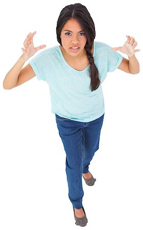 Angry young casual brunette gesturing on white background Stock Photo - Budget Royalty-Free & Subscription, Code: 400-07484245