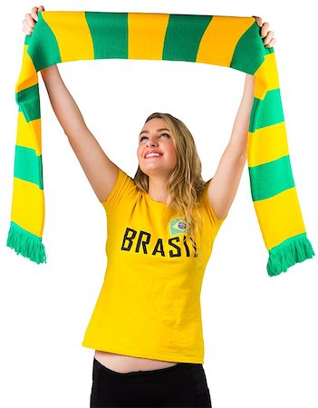 Excited football fan in brasil tshirt on white background Stock Photo - Budget Royalty-Free & Subscription, Code: 400-07484885