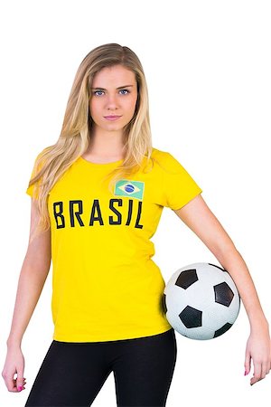 Pretty football fan in brasil tshirt on white background Stock Photo - Budget Royalty-Free & Subscription, Code: 400-07485003
