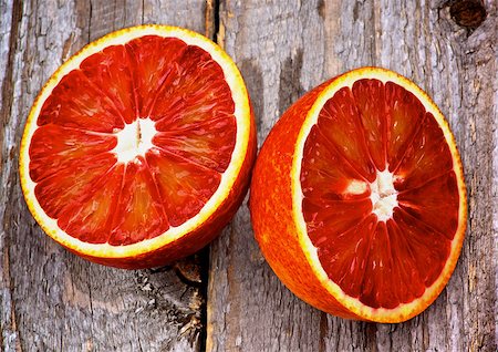 simsearch:400-08012355,k - Halves of Ripe Raw Blood Orange closeup on Rustic Wooden background Photographie de stock - Aubaine LD & Abonnement, Code: 400-07485284